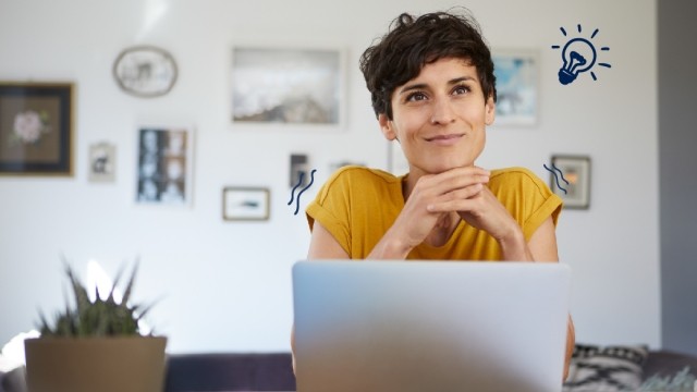 Woman sits in front of a laptop with a hand drawn doodle of a lightbulb over her shoulder.