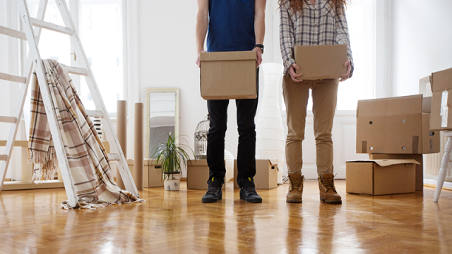 Young couple with moving boxes