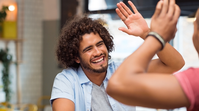 Man giving his friend a high-five