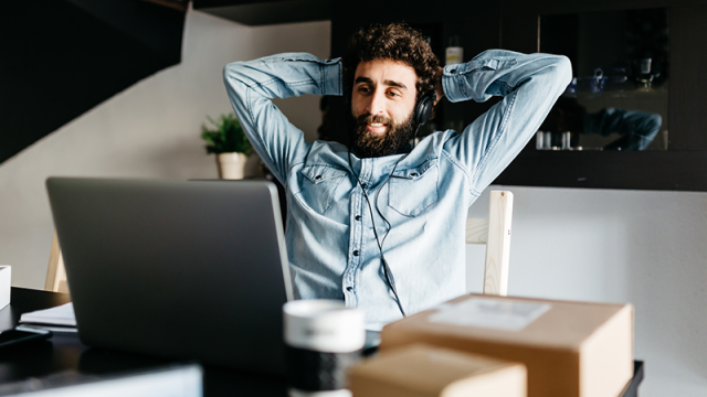 Man celebrating his success at a computer