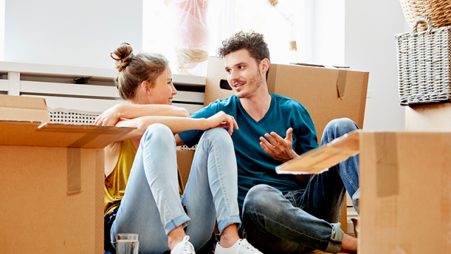 Young couple packing boxes