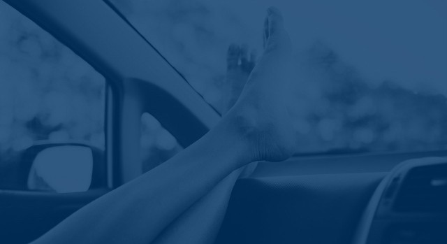 background image of feet on a dashboard