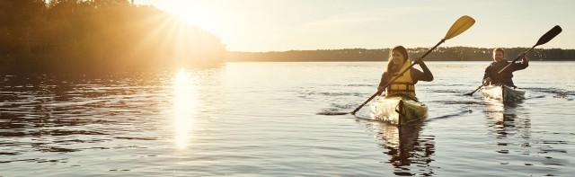 couple canoeing at sunset